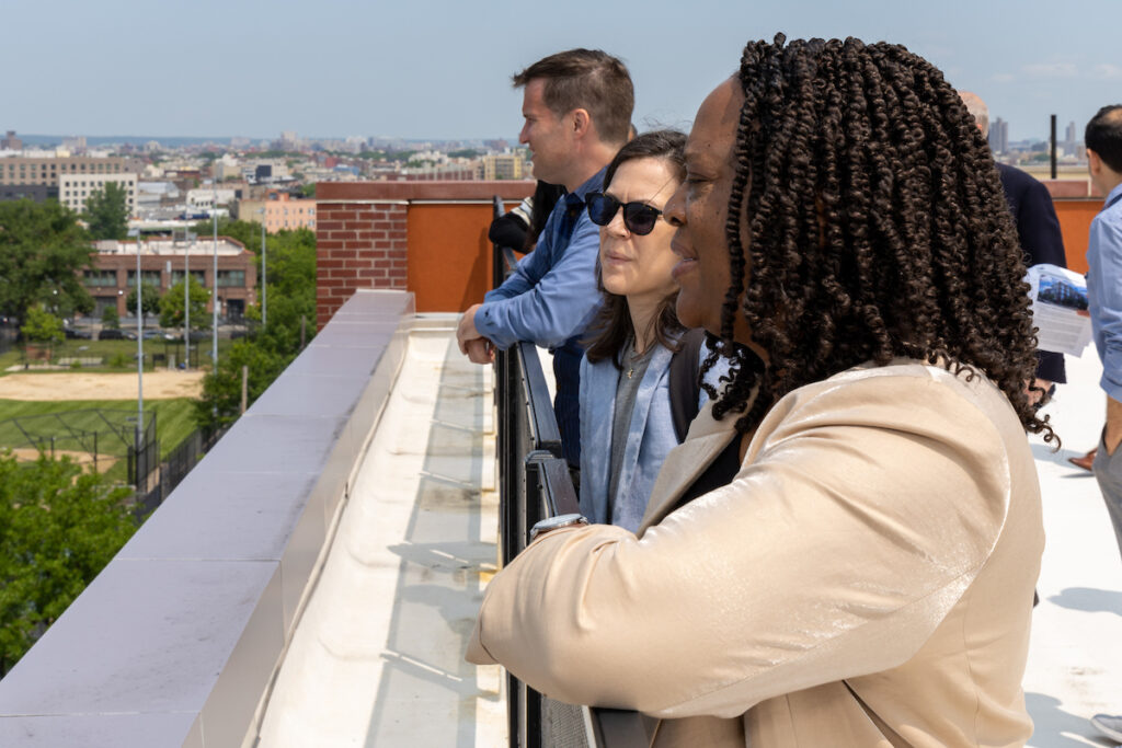 CDT Board and staff enjoying a charter school's rooftop view.
