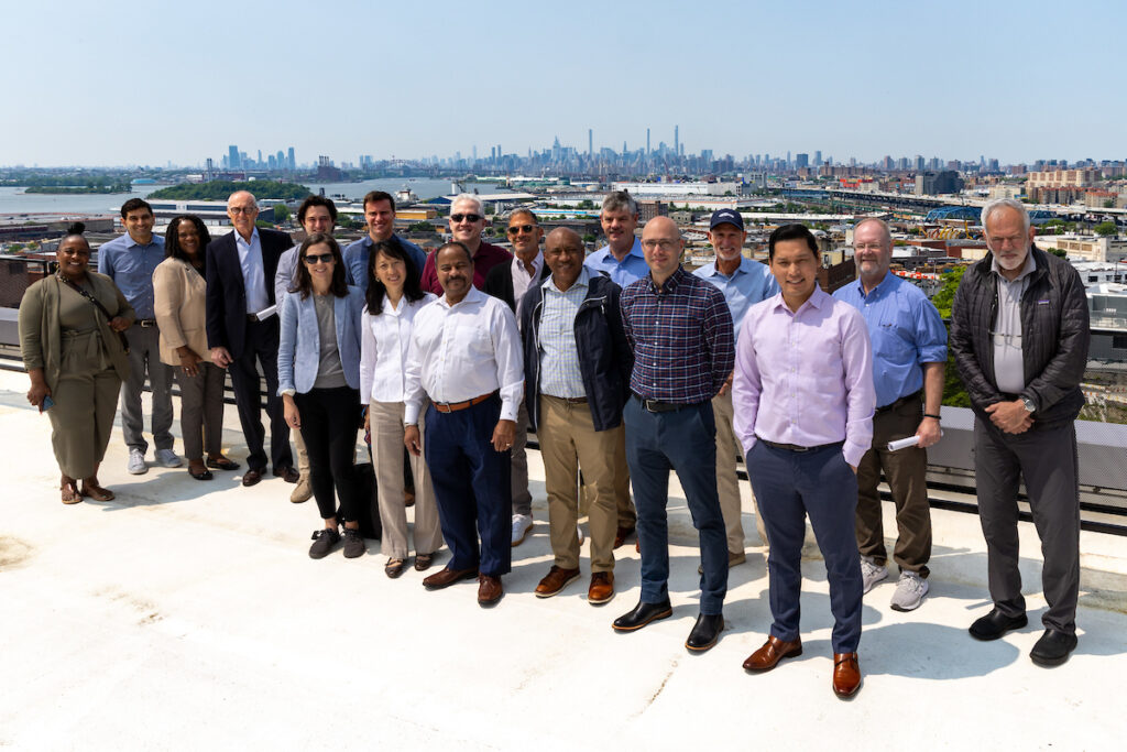 The CDT team portrait with NYC skyline view in the background.